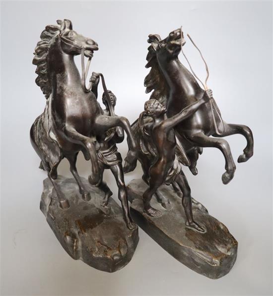 After Cousteau. A pair of early 20th century bronze Marli horse groups, 29cm high